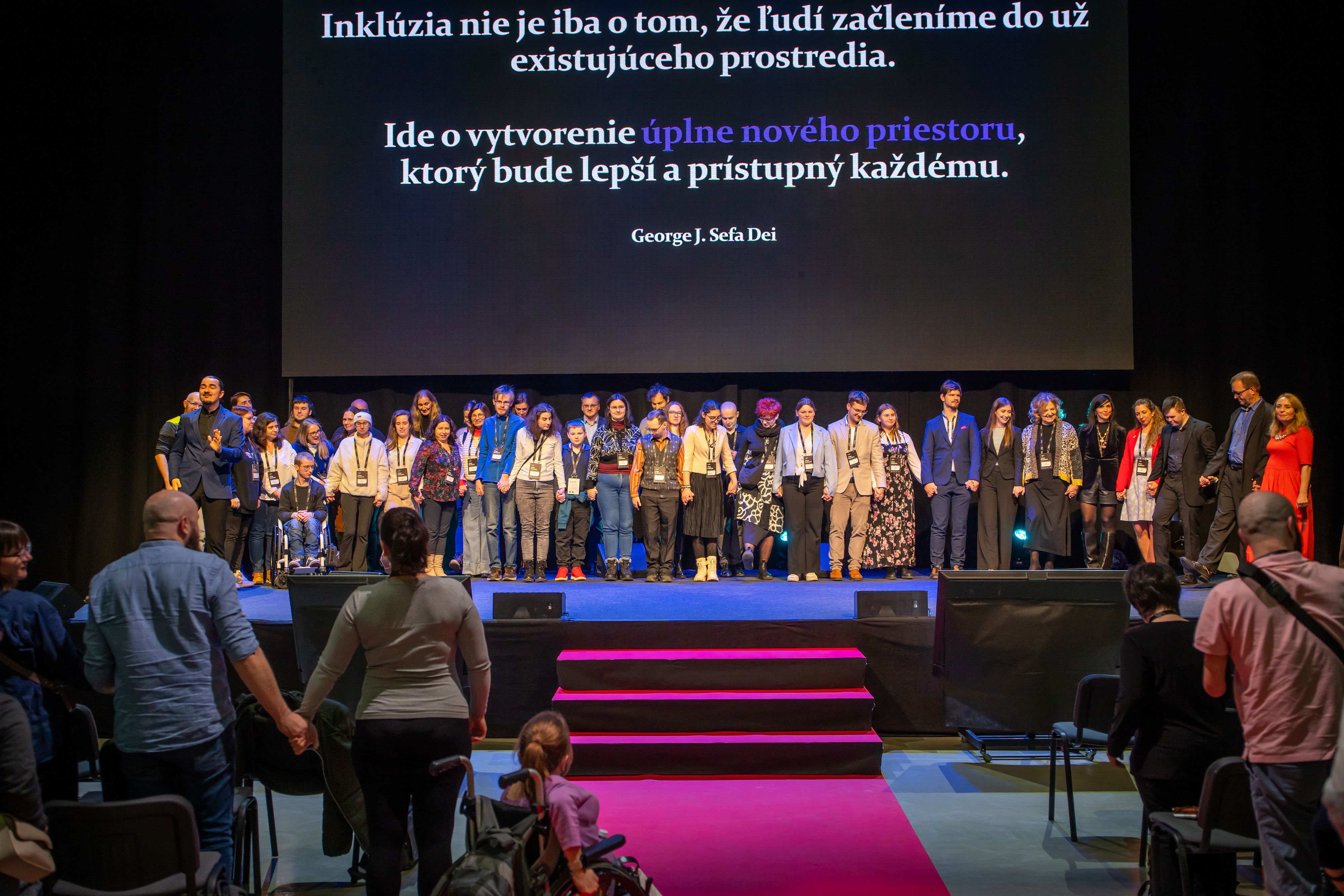 Volunteers and organization team on the stage - final scene of the conference.